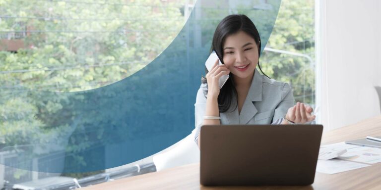 Smiling woman takes a call. Getting hired for an international accounting career is made easier when you possess these 5 essential qualities in this post.